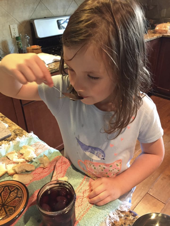 kid tasting olives